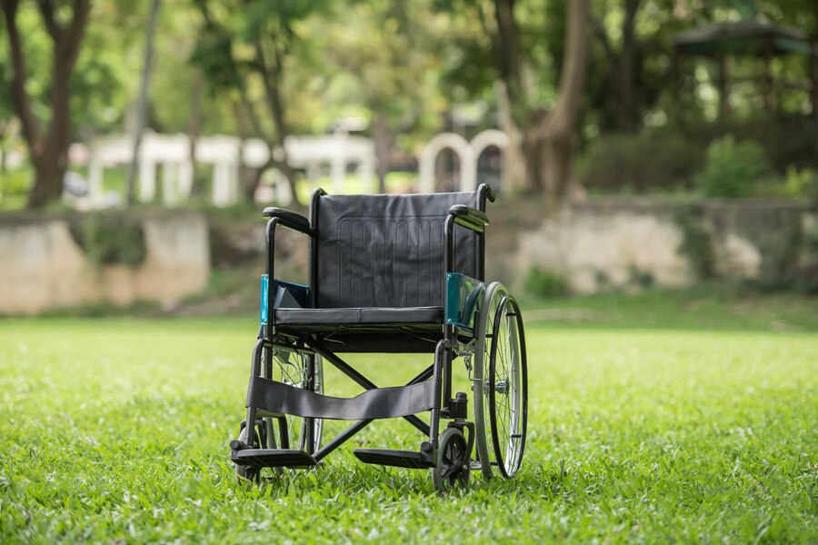 empty-wheelchair-parked-park-health-care-concept_1150-4360